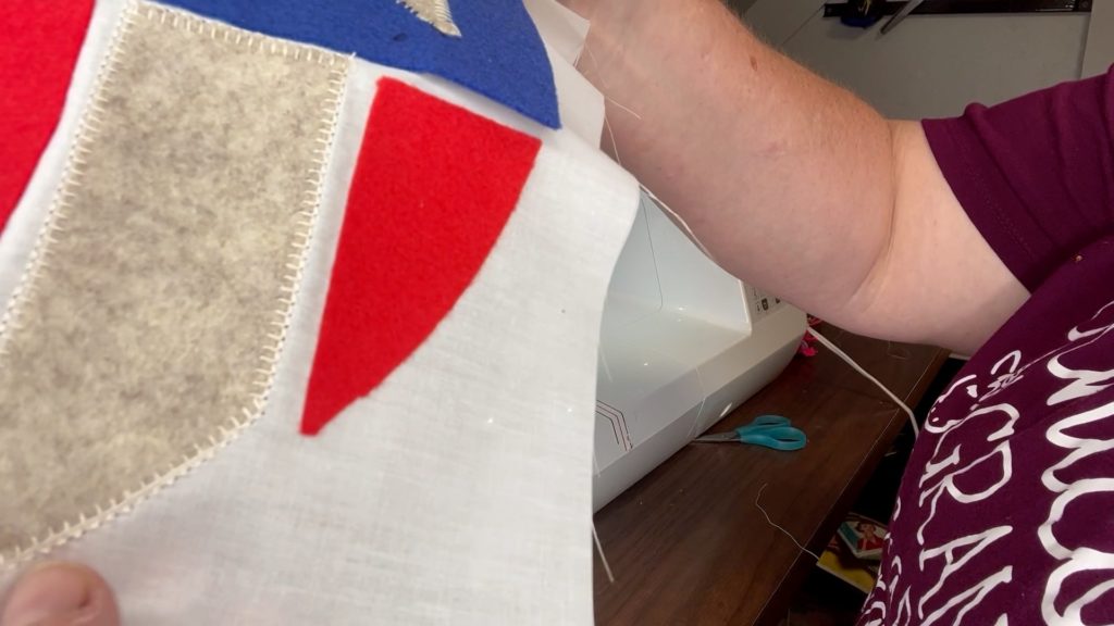 Blanket stitch was used to hold down the felt on a pillowcase