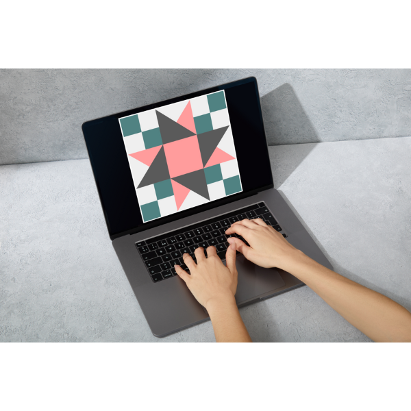 Finding the perfect quilt block on the computer to sew to a shirt.