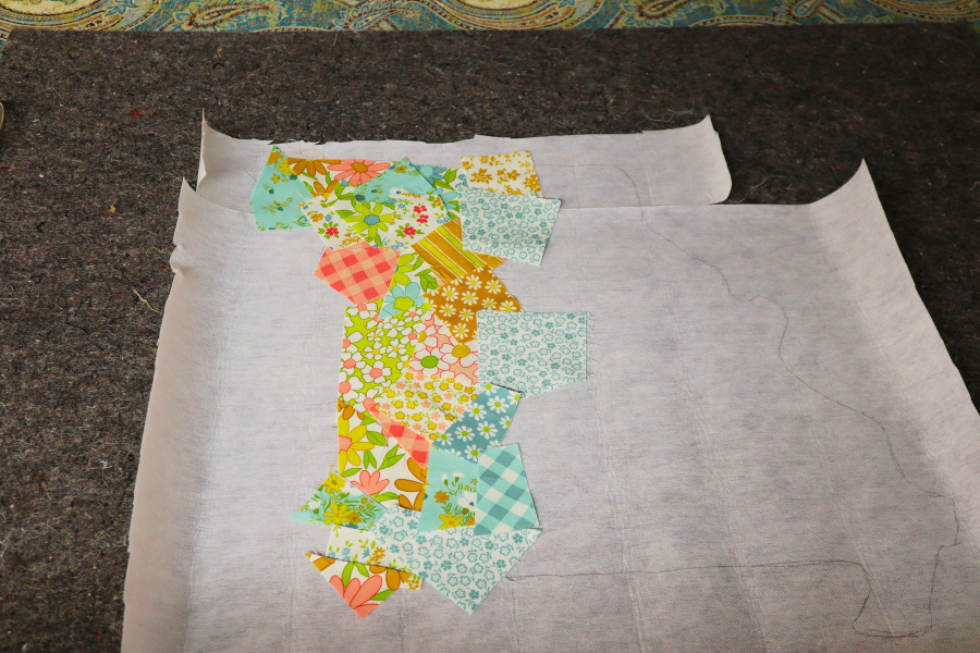 Adding cut fabric to interfacing in the shape of the state of Missouri