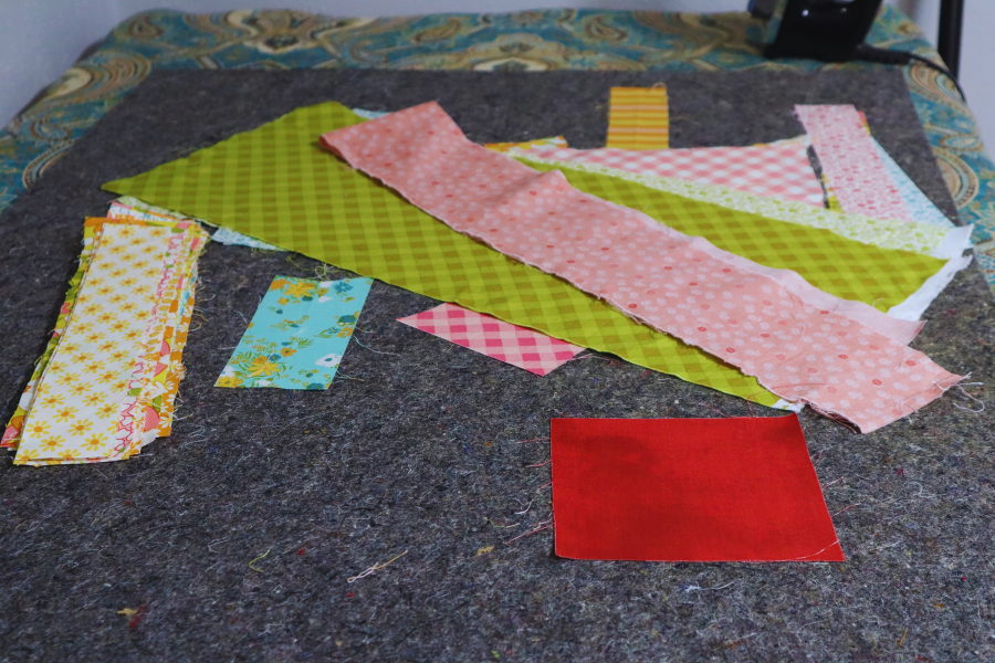 Fabric scraps to be used to make a collage.